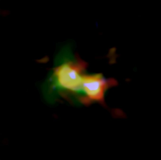 Imagen compuesta de B14-65666 donde se aprecia la distribución del polvo (rojo), el oxígeno (verde) y el carbono (azul) observados por ALMA y las estrellas (blanco) observadas por el telescopio espacial Hubble. Créditos: ALMA (ESO/NAOJ/NRAO), telescopio espacial Hubble NASA/ESA, Hashimoto et al.