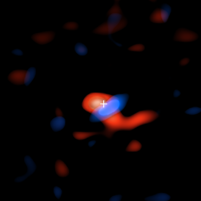 ALMA image of the disk of cool hydrogen gas flowing around the supermassive black hole at the center of our galaxy. The colors represent the motion of the gas relative to Earth: the red portion is moving away, so the radio waves detected by ALMA are slightly stretched, or shifted, to the "redder" portion of the spectrum; the blue color represents gas moving toward Earth, so the radio waves are slightly scrunched, or shifted, to the "bluer" portion of the spectrum. Credit: ALMA (ESO/NAOJ/NRAO), E.M. Murchikova; NRAO/AUI/NSF, S. Dagnello