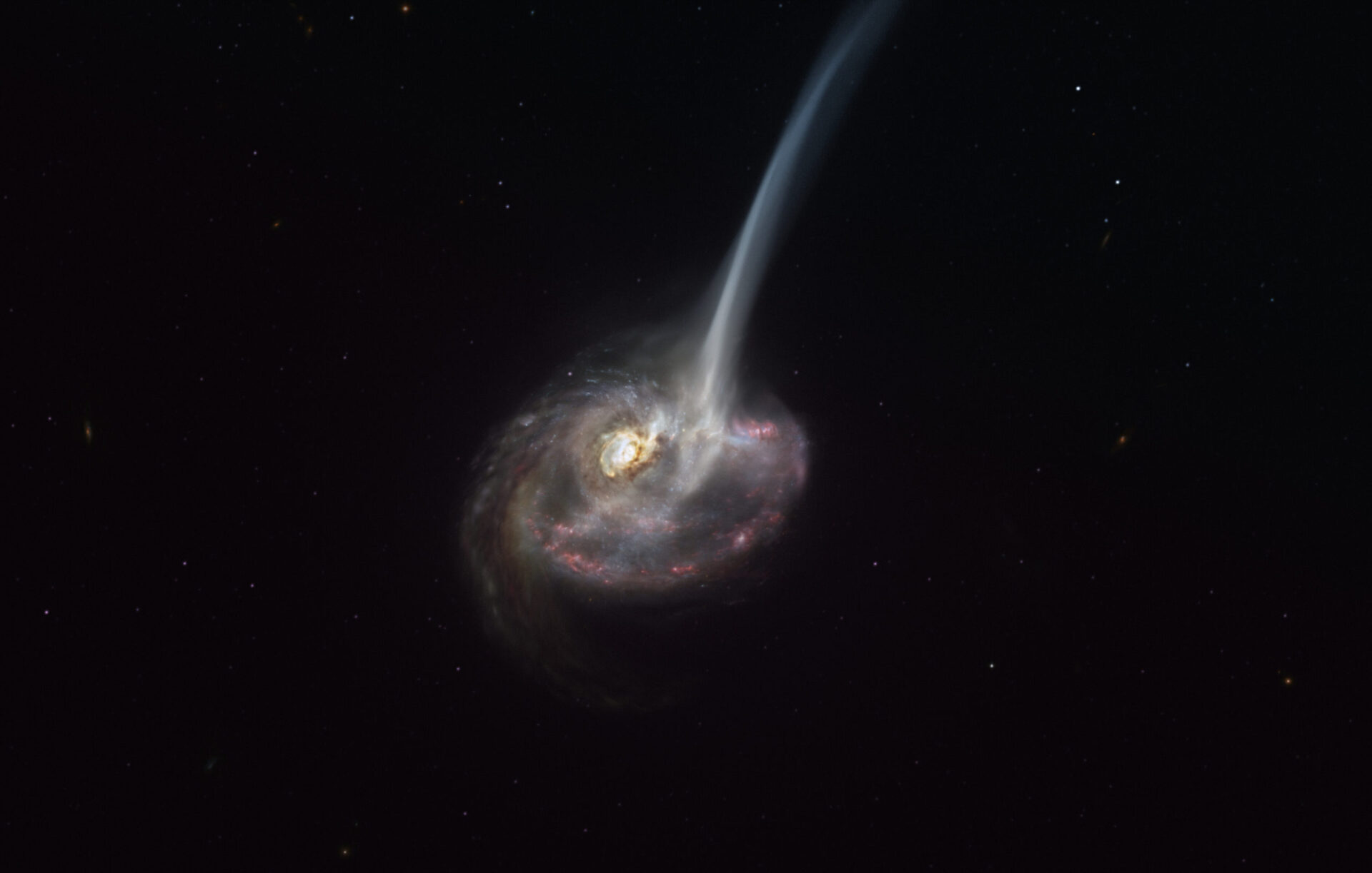 This artist’s impression of ID2299 shows the galaxy, the product of a galactic collision, and some of its gas being ejected by a “tidal tail” as a result of the merger. New observations made with ALMA, in which ESO is a partner, have captured the earliest stages of this ejection, before the gas reached the very large scales depicted in this artist’s impression. Credit: ESO/M. Kornmesser