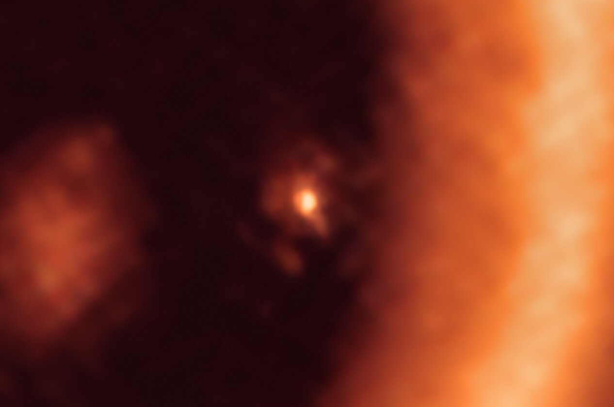 This image, taken with the Atacama Large Millimeter/submillimeter Array (ALMA), in which ESO is a partner, shows a close-up view on the moon-forming disc surrounding PDS 70c, a young Jupiter-like gas giant nearly 400 light-years away. It shows this planet and its disc centre-front, with the larger circumstellar ring-like disc taking up most of the right-hand side of the image. The dusty circumplanetary disc is as large as the Sun-Earth distance and has enough mass to form up to three satellites the size of the Moon. Credit: ALMA (ESO/NAOJ/NRAO)/Benisty et al.