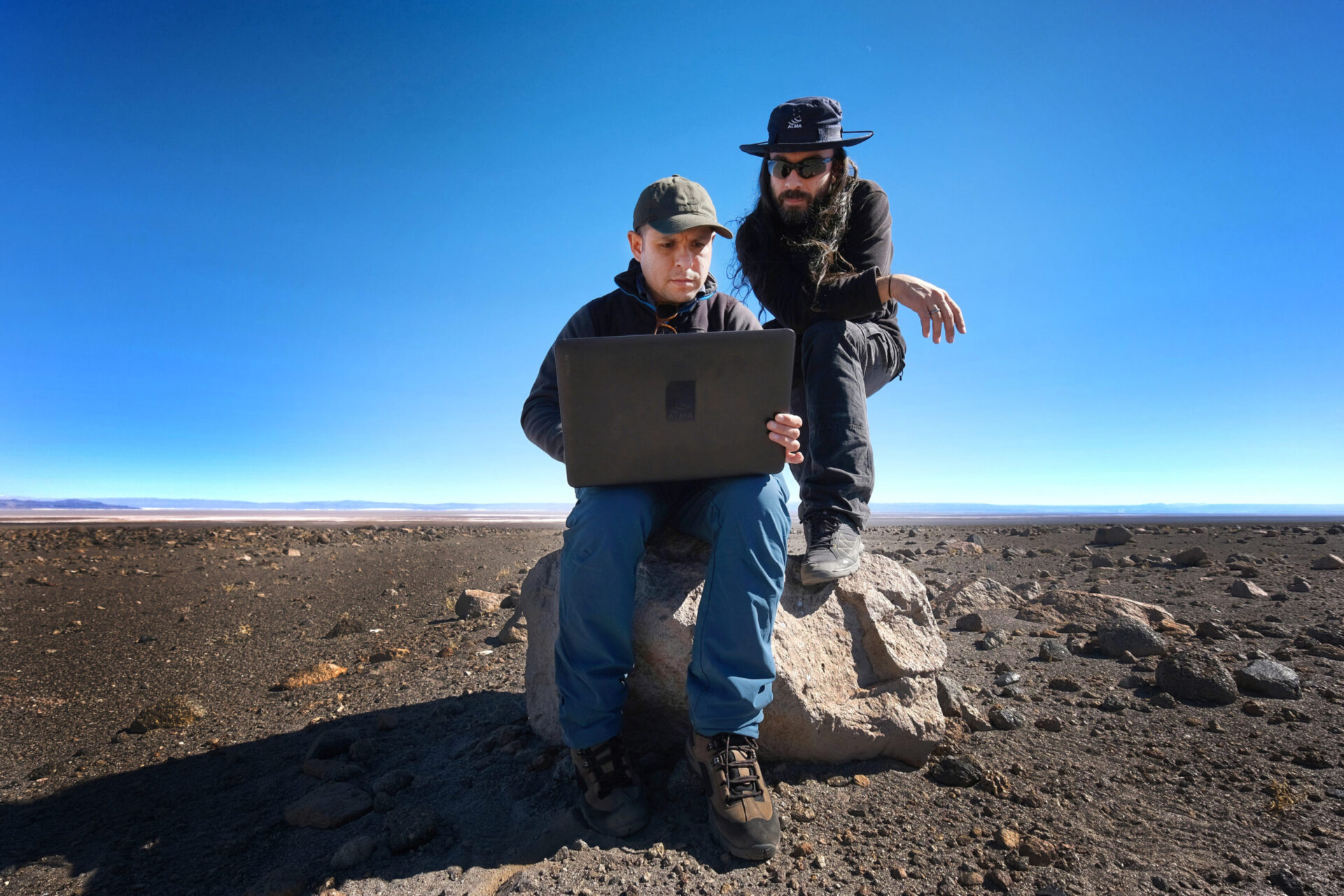 <p>Juan Cortés and Sergio Martin, ALMA astronomers working on the field to determine the alignment of the saywas with the Sun and with different constellations. Credit: R. Bennett - ALMA (ESO/NAOJ/NRAO)</p>
