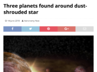 Three planets found around dust-shrouded star