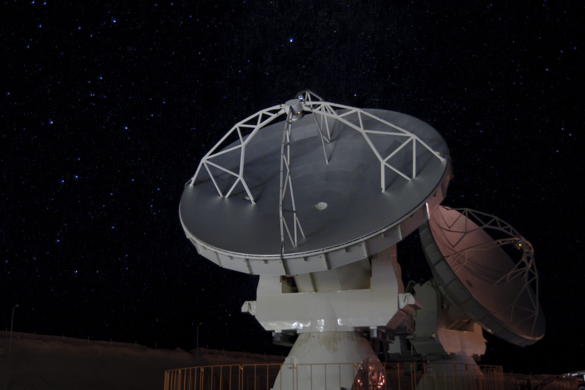 Two 12 meter/diameter ALMA antennas.