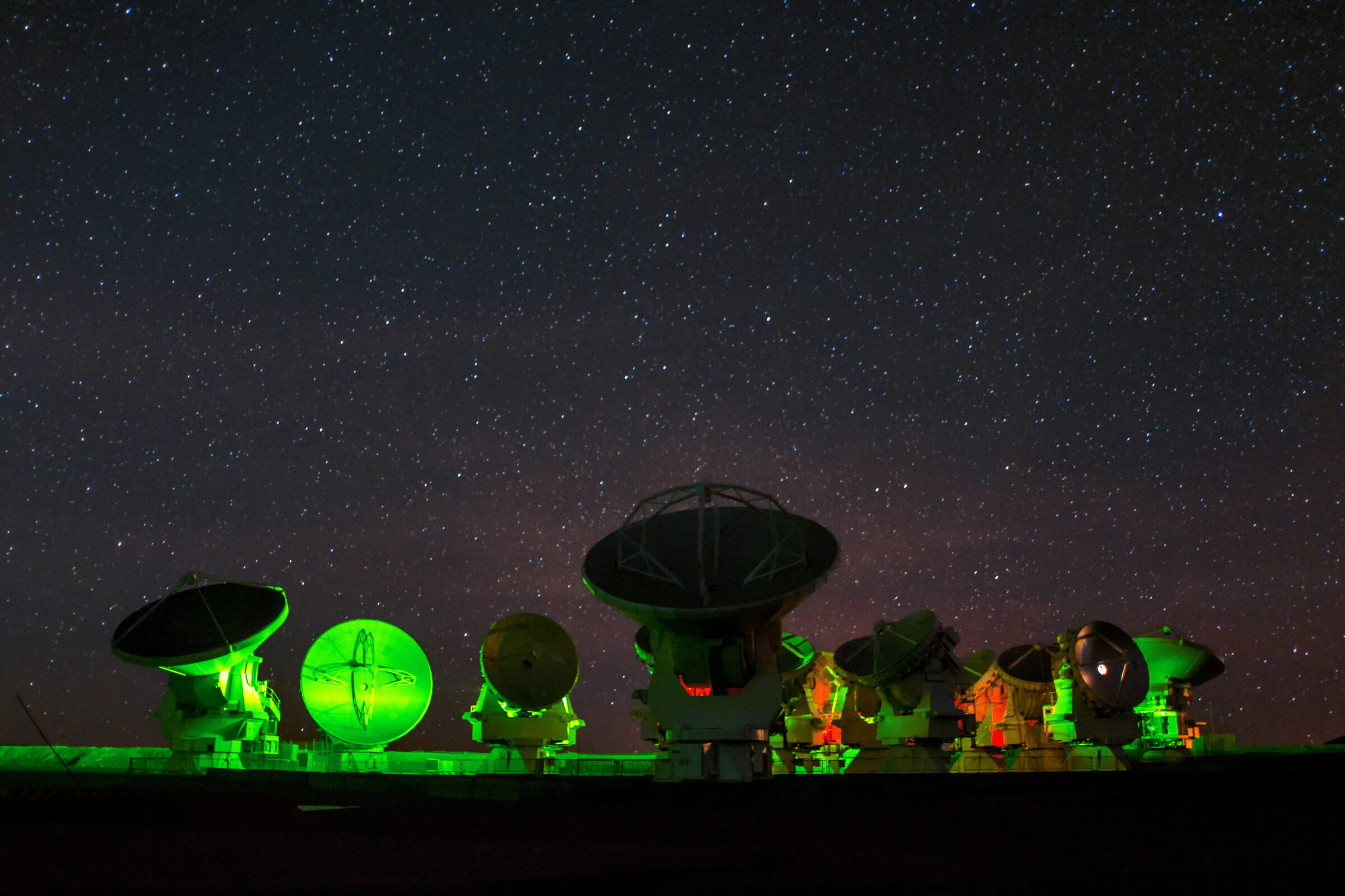 ALMA, lit in neon green