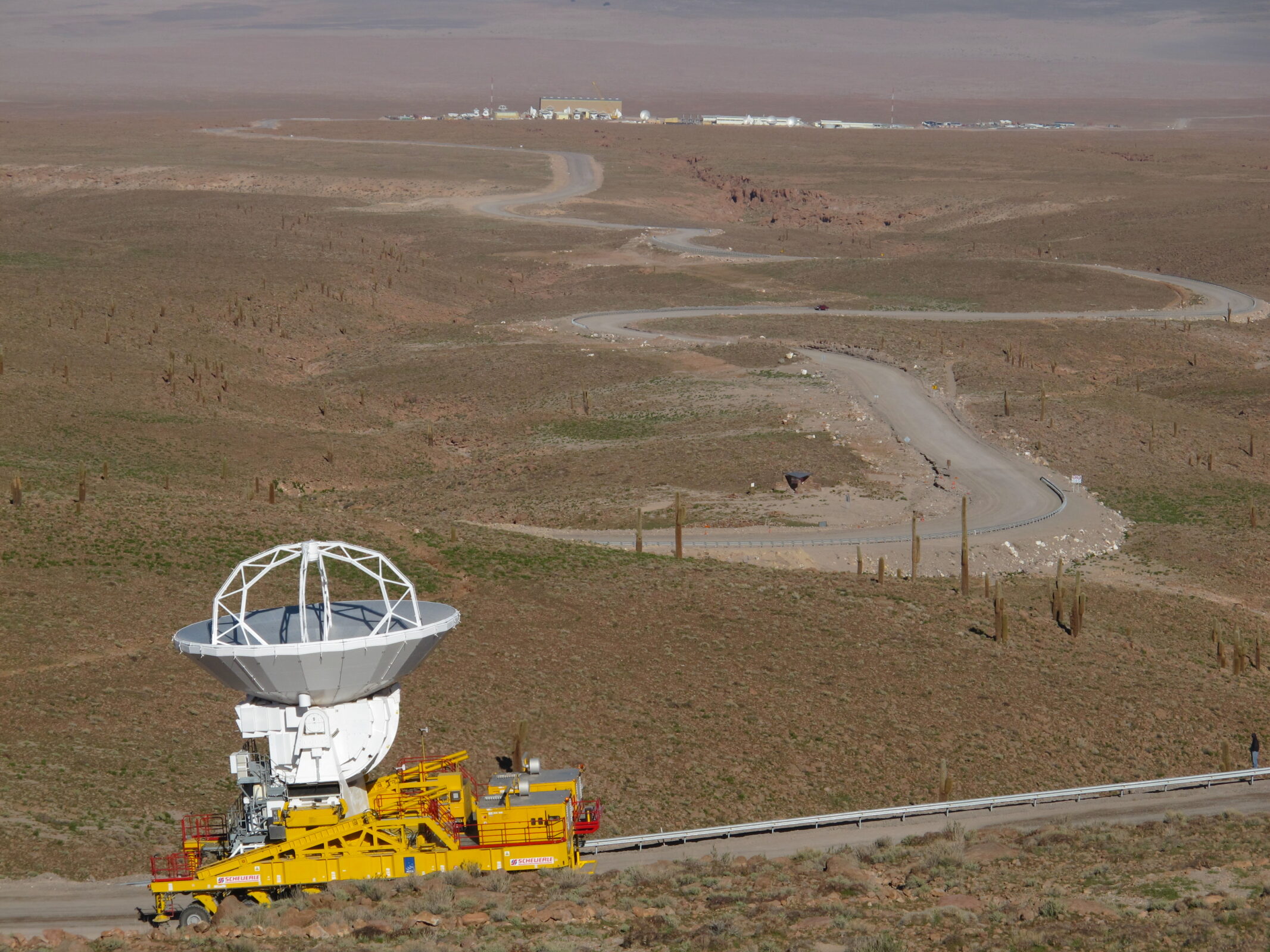 A transporter climbing the winding road to Chajnantor