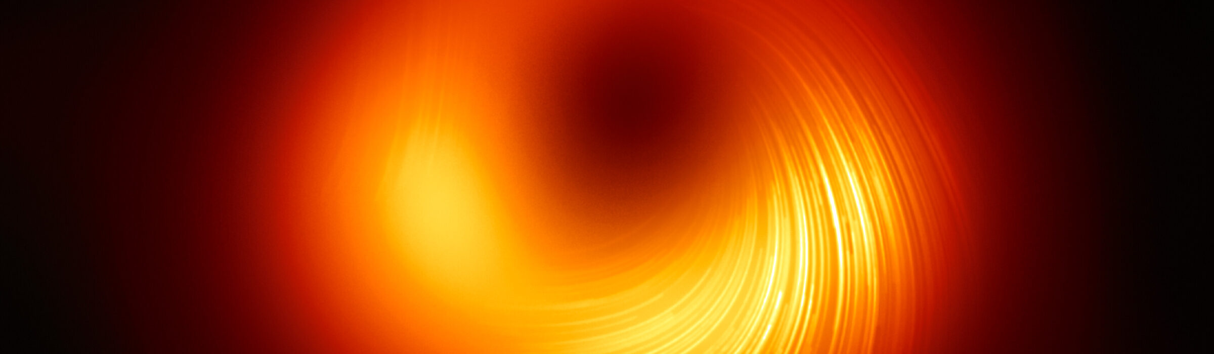 Astrónomos obtienen imágenes de campos magnéticos en el borde del agujero negro de M87