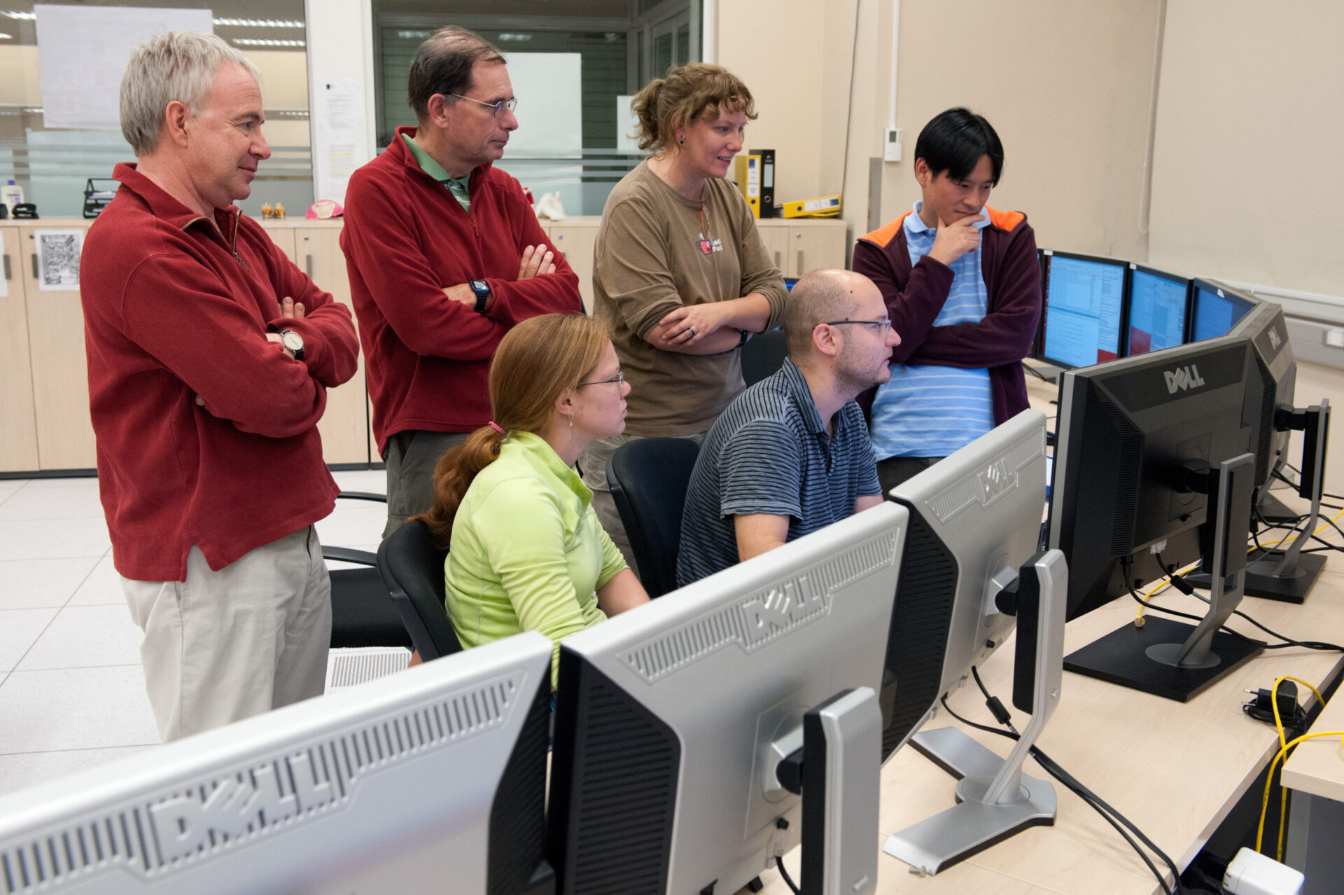 <p>OSF Control Room, AOS Console, during Antennae Array correlations. Night shift astronomers present, left to right, are: Rainer Mauersberger (ESO, Germany); Robert Lucas (ESO; France); Adele Plunkett (US, sitting); Alison Peck (US; Dep project scientist); Manuel Aravena (Chile, sitting); Mareki Honma (Japan).</p>
<p>Credit:<br />
ESO/Max Alexander</p>
