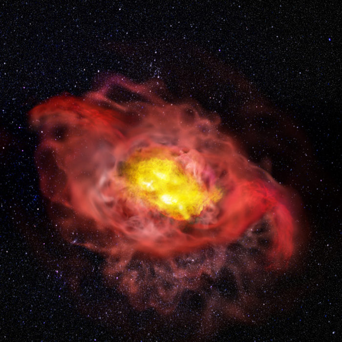 This artist’s conception illustrates the previously unknown complexity of the young galaxy, A1689-zD1. Reaching far beyond the center of the galaxy, shown here in pink, is an abundant halo of cold carbon gas. For scientists, this uncommon feature indicates that the galaxy may be much larger than previously believed and that early stages of normal galaxy formation may have been more active and dynamic than theorized. To the upper left and lower right are outflows of hot, ionized gas pushing outward from the center of the galaxy, shown here in red. Scientists believe it is possible that these outflows have something, though they don’t yet know what, to do with the presence of cold carbon gas in the outer reaches of the galaxy. Credit: ALMA (ESO/NAOJ/NRAO), B. Saxton (NRAO/AUI/NSF)