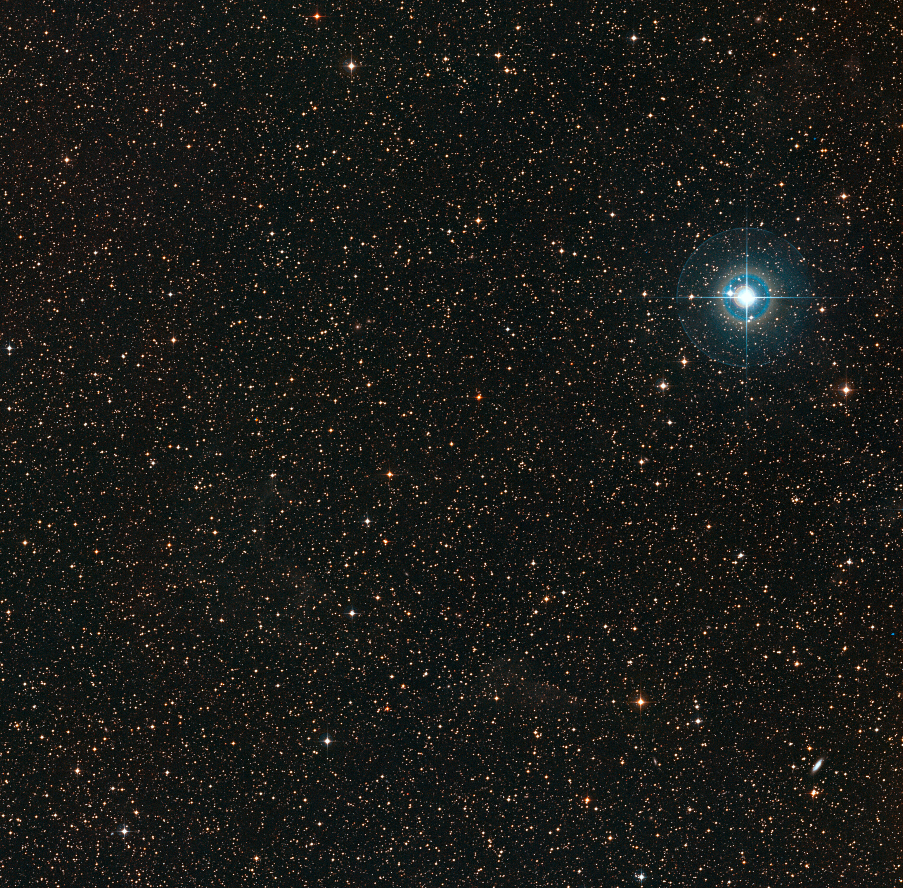 This colourful image shows the sky around the faint orange dwarf star PDS 70 (in the middle of the image). The bright blue star to the right is χ Centauri. Credit: ESO/Digitized Sky Survey 2. Acknowledgement: Davide De Martin